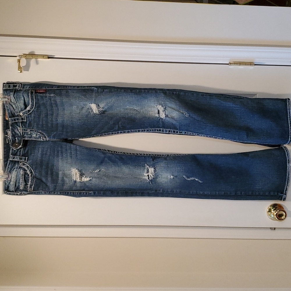 Silver distressed boot cut jeans